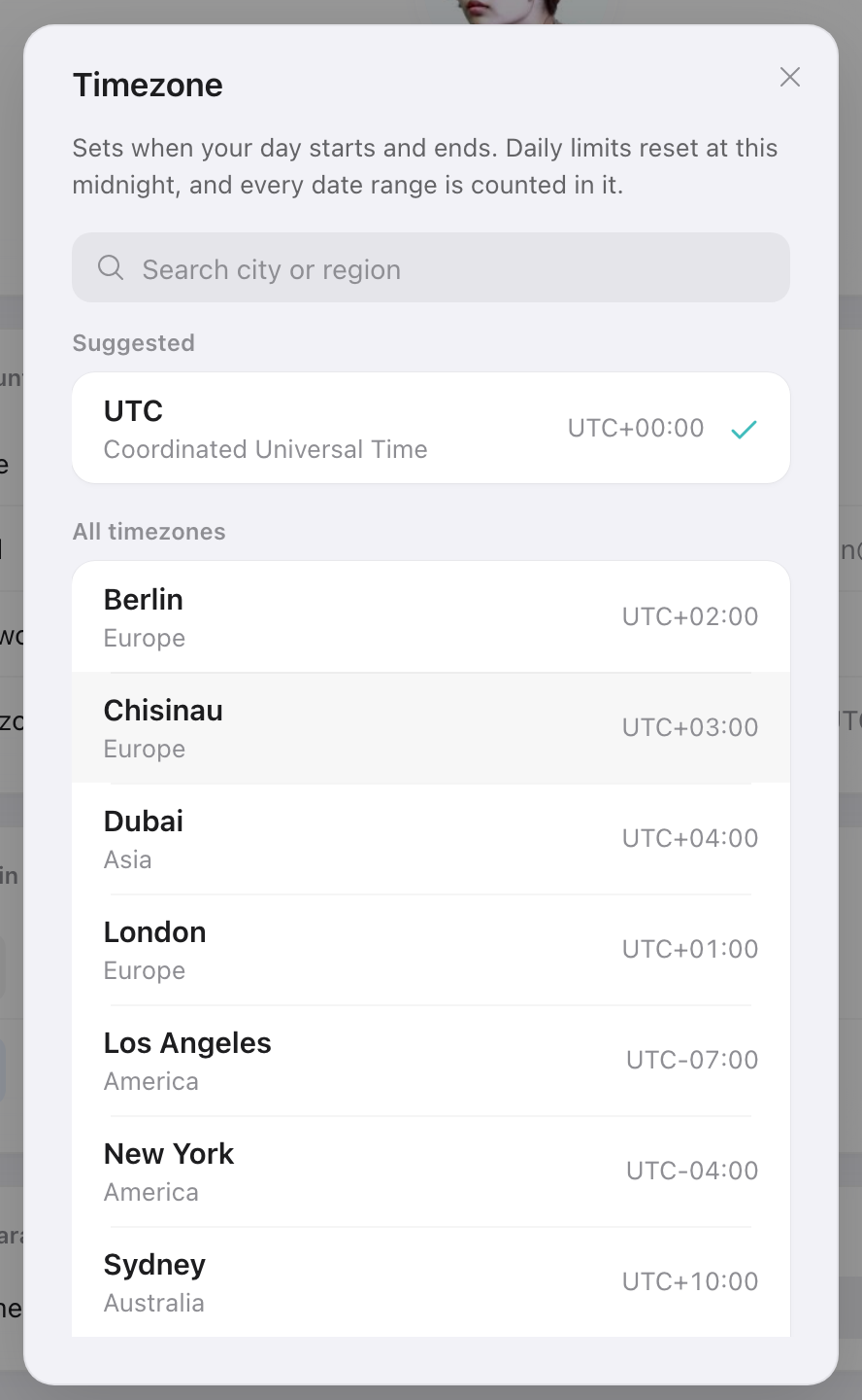 Timezone picker in Settings: search by city, with your device timezone and UTC suggested at the top